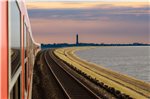 Nur als Fotomontage realisiert: ein Eisenbahndamm vom Festland nach Norderney. Archivbild